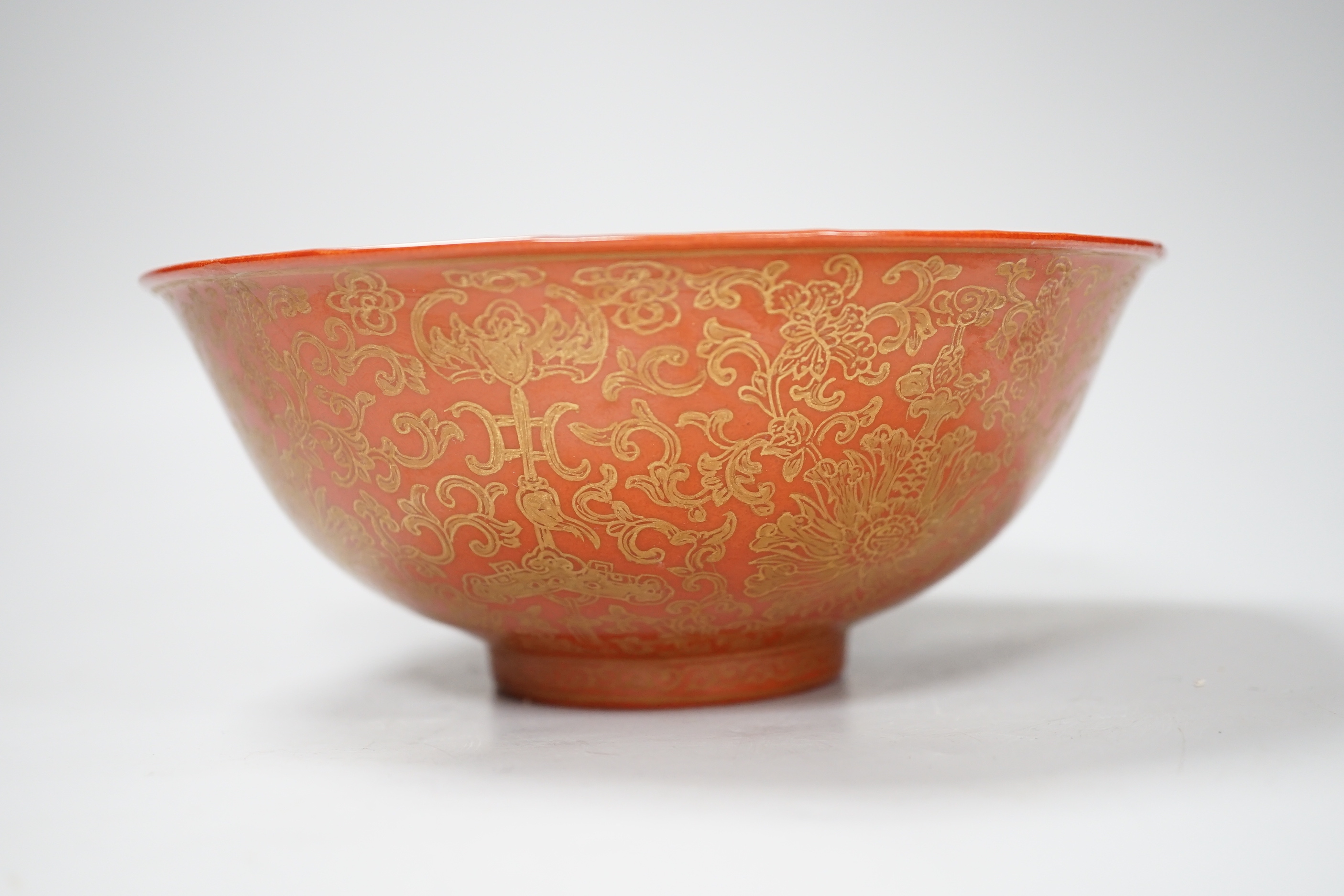 A Chinese gilded coral-ground bowl, 17cm diameter